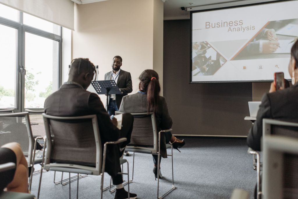 Business mentor delivering entrepreneurship training to young professionals.